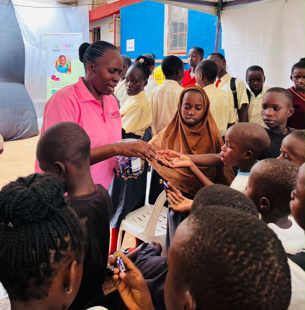 ABATO team supporting children during a guided activity